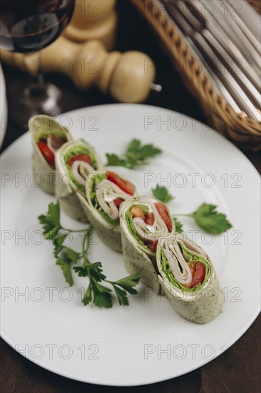 Slices of rolled sandwich on plate