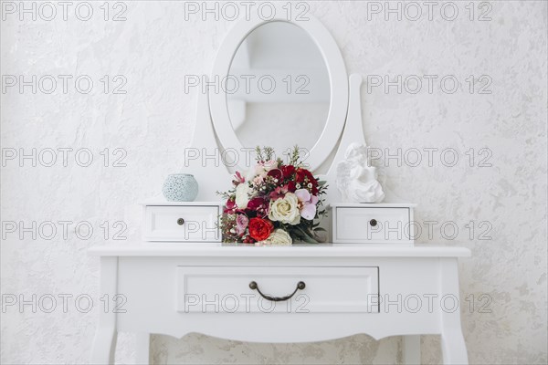 Bouquet of flowers on white vanity