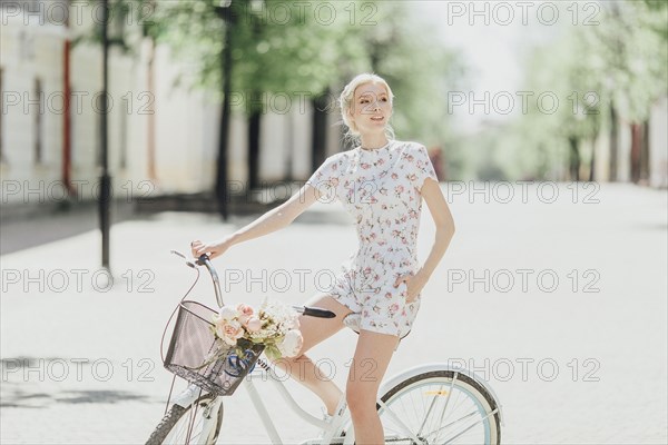 Middle Eastern woman sitting on bicycle