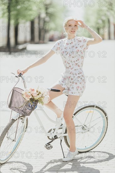 Middle Eastern woman sitting on bicycle