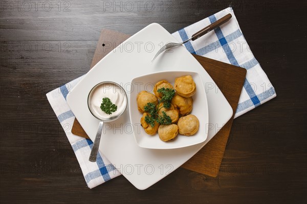 Fried food in bowl with dipping sauce