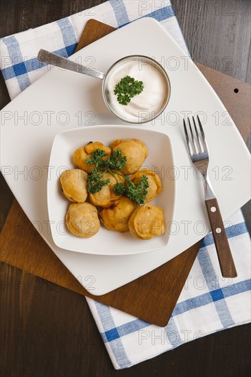 Fried food in bowl with dipping sauce