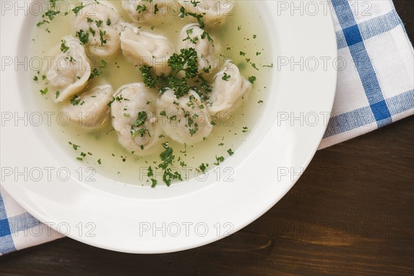 Dumplings in bowl of soup