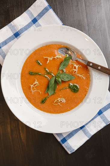 Basil in bowl of tomato soup