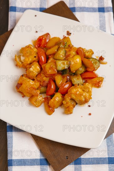 Orange chicken with tomatoes