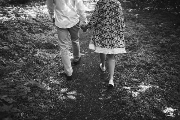 Middle Eastern couple walking on dirt path