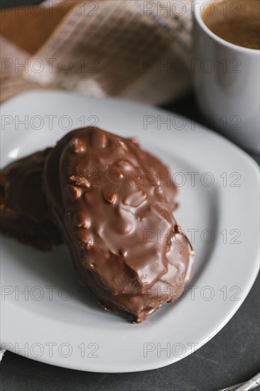 Chocolate cookies with nuts on plate