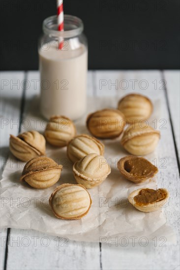 Cookies on wax paper with milk