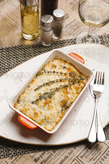 Rosemary on casserole in pan