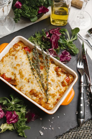 Rosemary on casserole in pan