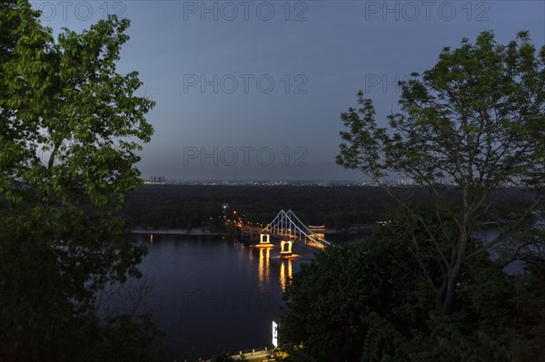 Scenic view of bridge over river at night