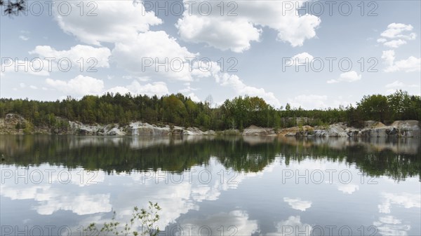 Reflection of clouds in still lake