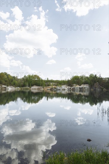 Reflection of clouds in still lake