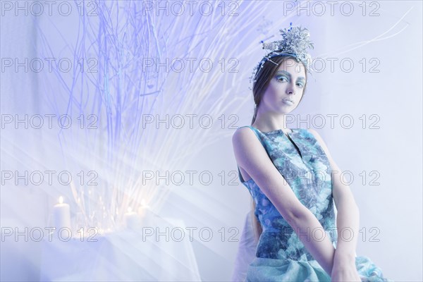 Ethereal woman wearing blue dress and makeup