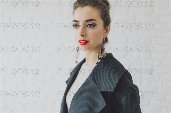 Portrait of glamorous Middle Eastern woman wearing earrings