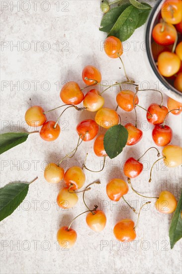 Cherries on white wooden table