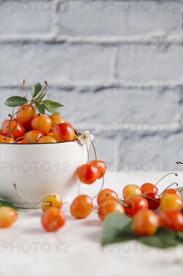Cherries on white wooden table