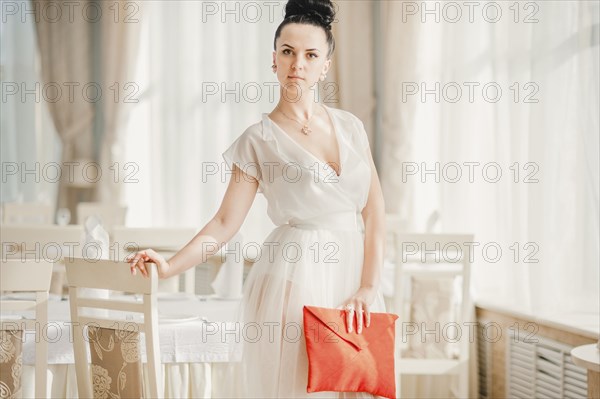 Glamorous Middle Eastern woman holding purse