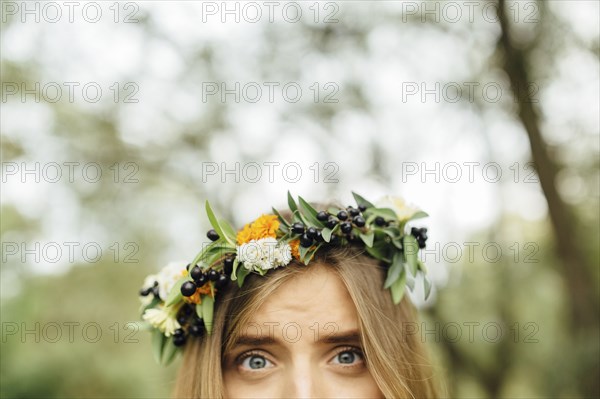 Eyes of Middle Eastern woman wearing flower crown