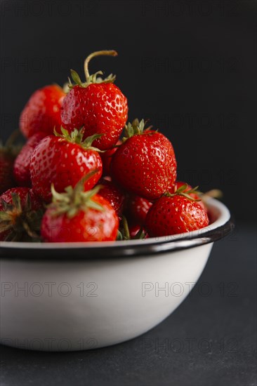 Close up of bowl of strawberries