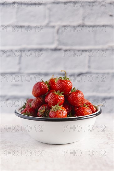 Close up of bowl of strawberries