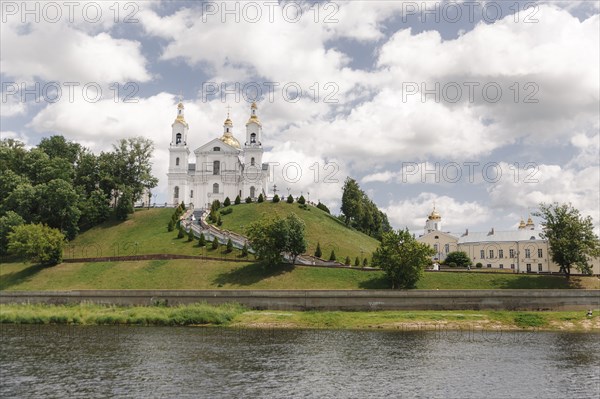 Scenic view of castle on hill near river
