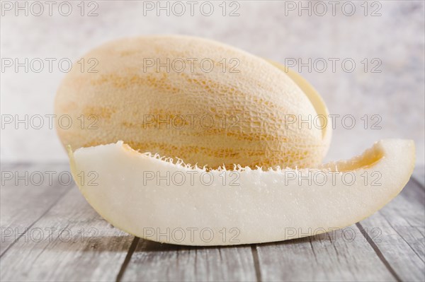 Slice of melon on wooden table