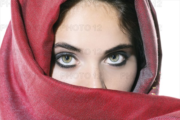 Woman peering over veil
