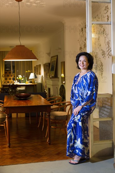 Caucasian woman smiling in dining room