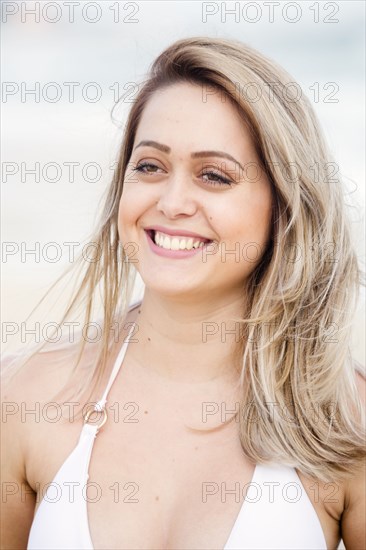 Smiling Mixed Race woman wearing bikini