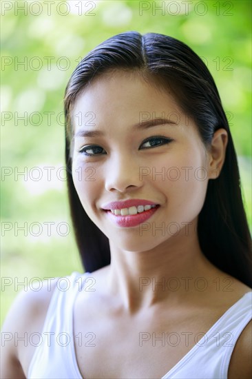 Portrait of smiling Asian teenage girl