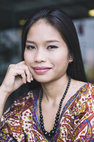 Portrait of smiling Asian woman