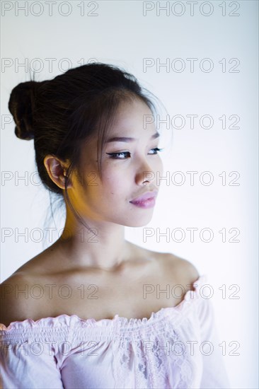 Portrait of pensive Asian woman