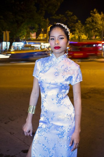 Portrait of serious Asian woman wearing traditional clothing