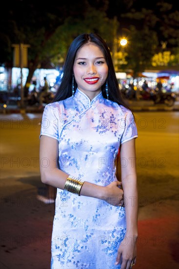 Portrait of smiling Asian woman wearing traditional clothing