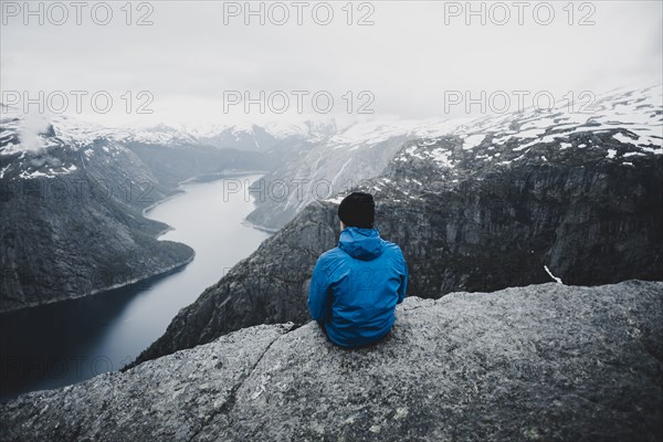 Caucasian man admiring scenic view of mountain river