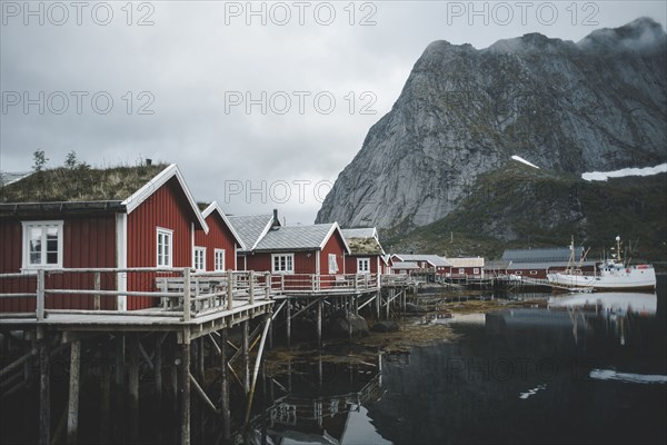 Houses at waterfront of still lake