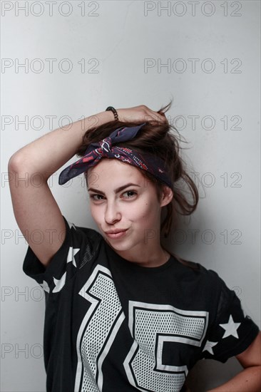 Confident Caucasian woman wearing football jersey