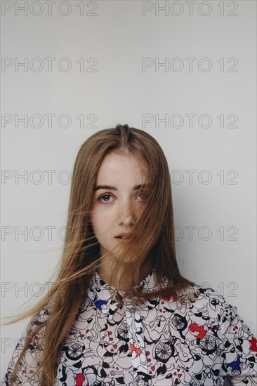 Wind blowing hair of Caucasian teenage girl