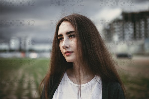 Pensive Caucasian woman outdoors