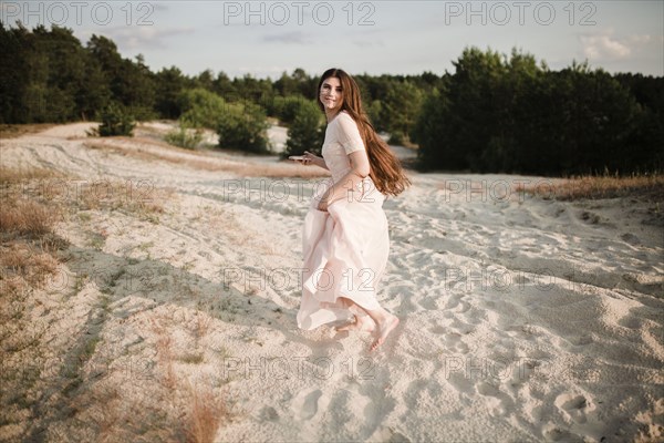 Caucasian woman running on beach
