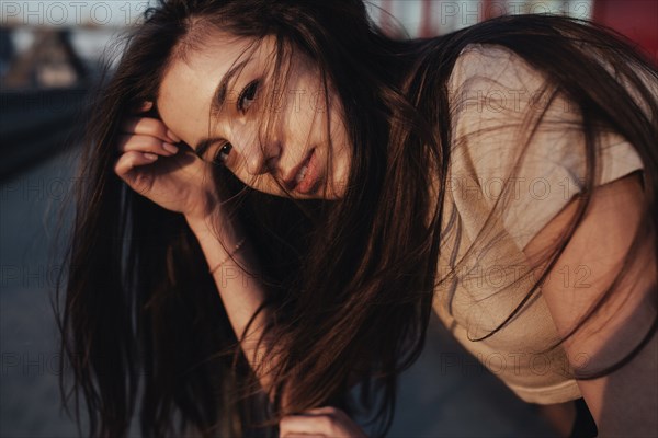 Wind blowing hair of Caucasian woman