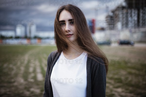 Wind blowing hair of Caucasian woman