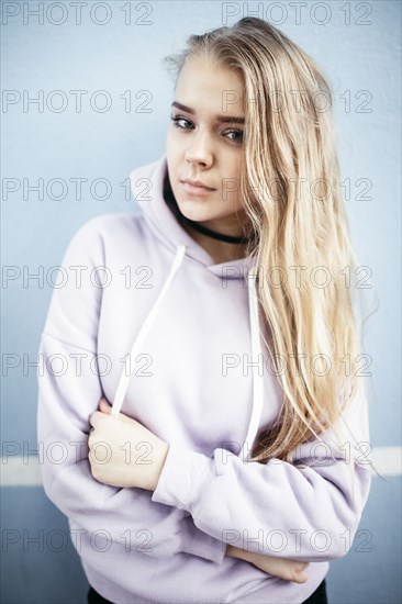 Portrait of serious Caucasian woman wearing hoodie