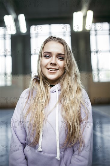 Portrait of smiling Caucasian woman wearing hoodie