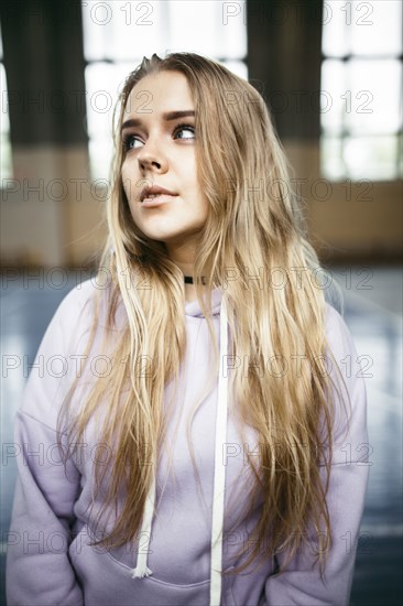 Portrait of pensive Caucasian woman in gymnasium