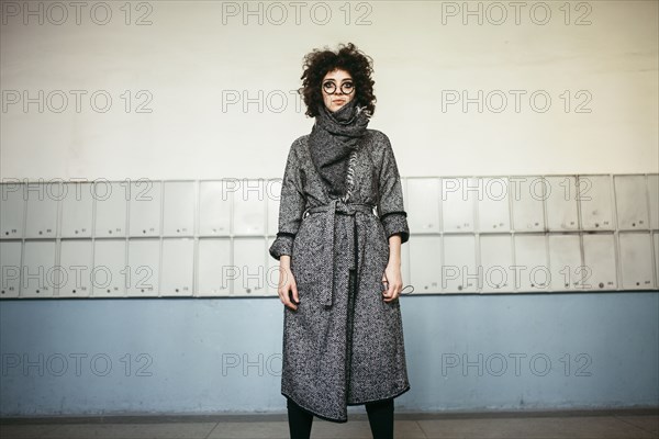 Serious Caucasian woman wearing scarf and coat