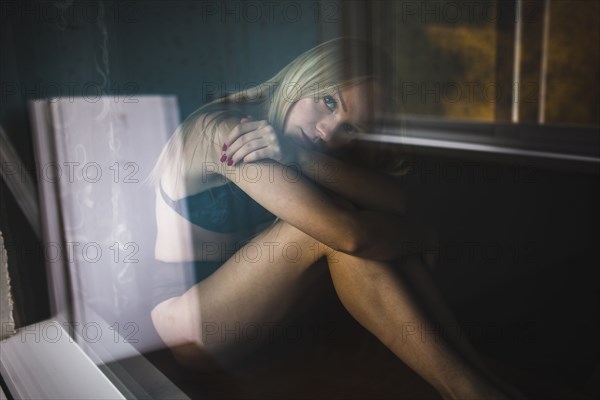 Close up of pensive Caucasian woman resting near window