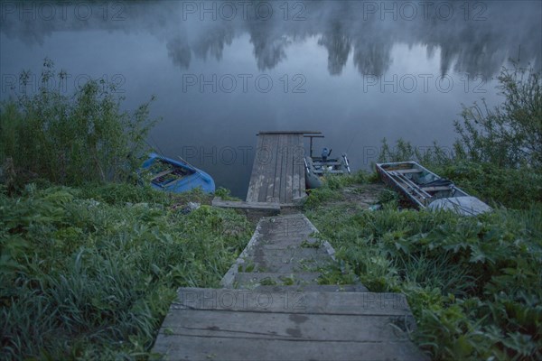 Wooden dock in still rural lake