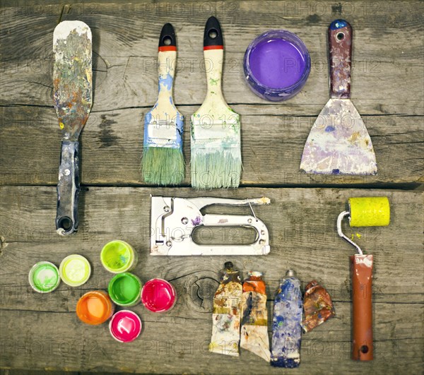 Painter's supplies on wooden table